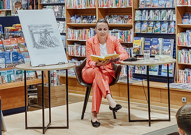female author reads in a bookstore